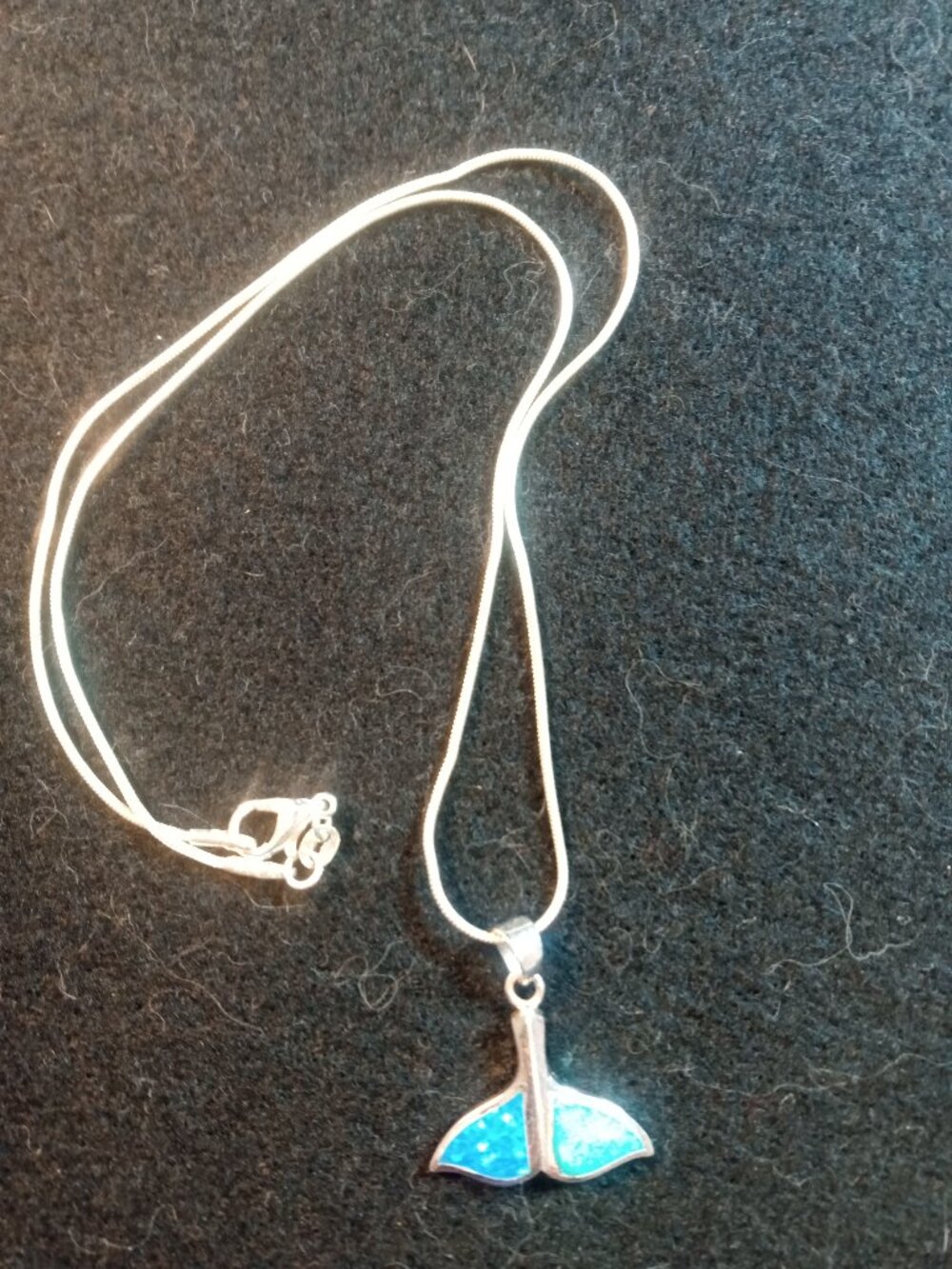 Hawaiian blue fire opal and silver whale tail pendant.  18" long chain.
